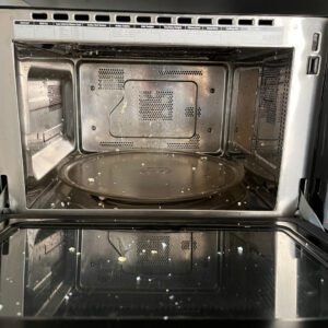 Microwave with Cheese and Eggs residue stuck on the inside before cleaning